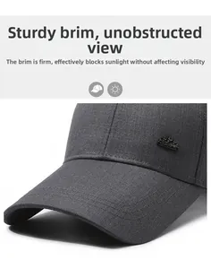 Detail of structured long brim and metal star emblem on dark gray baseball cap