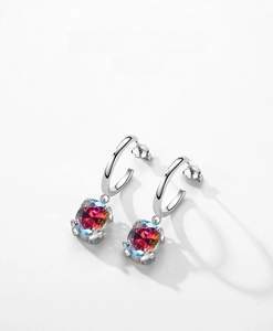 Macro shot of S925 sterling silver drop earrings with faceted rainbow colorful zircon