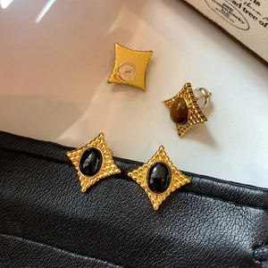 Boucles d'oreilles vintage ovales en œil de tigre avec détails en étoile dorée