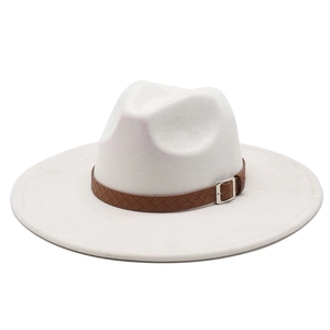 Detail of wide brim fedora hat with brown woven leather band and silver square buckle