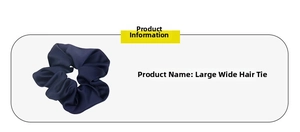 Detail of navy blue satin wide scrunchie showing fabric texture and pleated design