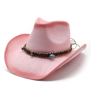 Pink straw Western cowboy hat with wide brim and turquoise beaded woven decorative band