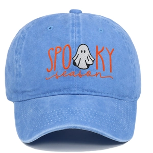 Detail of Spooky Season embroidery and white ghost on washed blue cotton baseball cap