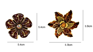 Detailed comparison showing dimensions of two vintage floral brooches with enamel and crystals