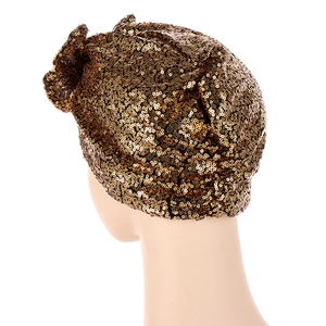 Elegant gold sequin turban hat for women featuring a sparkling metallic finish from a side view