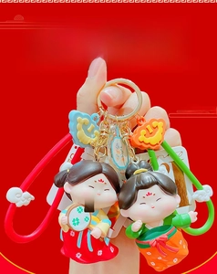 Close-up of cute Tang dynasty style cartoon girl vinyl keychain in traditional outfits