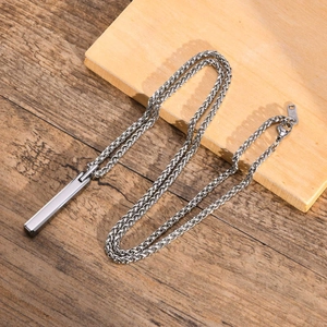 Detailed view of silver tungsten steel rectangular bar pendant on a Cuban chain