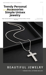 Macro shot of titanium steel cross pendant fully paved with sparkling white cubic zirconia