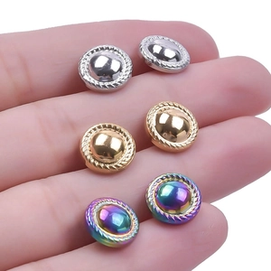 Close-up of polished stainless steel stud earrings with rope-style twisted edges