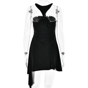 Detail of the backless black dress showing the halter neck knot and asymmetrical hemline