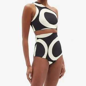 Detail of high-waist bikini featuring black and white abstract geometric circle pattern
