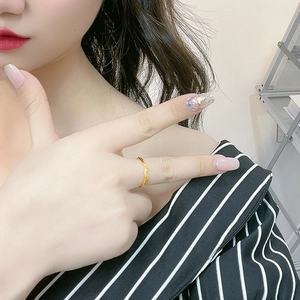 Minimalist s925 silver twisted open ring in gold finish worn on a model finger