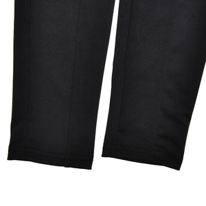 Close-up of the black bodysuit hemline showing fabric texture and neat stitching details