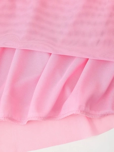 Detail of pink mesh fabric showing fine mesh texture, soft drapes, and hem stitching