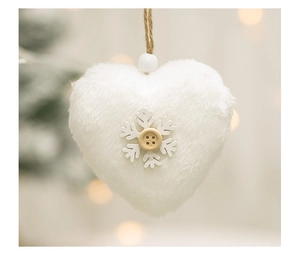 Macro view of white heart plush Christmas ornament with wooden snowflake detail