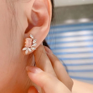 Elegant silver stud earrings with large rectangular pink gemstone and marquise accents