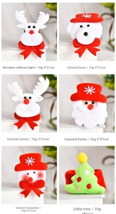 Detail view showing assorted Christmas slap bracelets with plush deer, santa, and bear designs