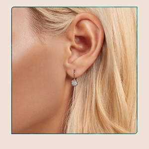 Close-up of elegant S925 silver hook earrings with a sparkling 1-carat moissanite stone