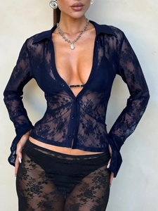 Detail of navy blue lace long sleeve V-neck cardigan with intricate floral patterns