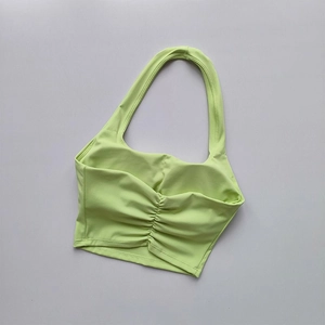 Light green halter sports bra with ruched hem detail and built-in pads for women
