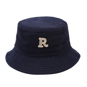 Minimalist navy blue cotton bucket hat with white R letter embroidery and twill texture