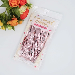 Rose gold foil fringe curtain in packaging for birthday party wall decoration