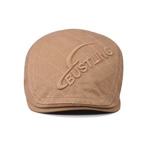 British vintage khaki flat cap featuring diamond quilting and bustling embroidery