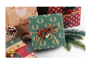 Close-up of vintage kraft Christmas wrapping paper with deer patterns and pine cones