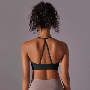 Back view of black halter yoga bra with skinny T-back straps and elastic fabric