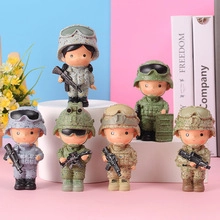 Detail of six miniature soldier figurines in colorful camouflage gear on a pink display