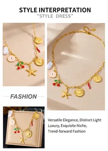 Detailed close-up of a gold-plated charm necklace featuring colorful enamel and pearls