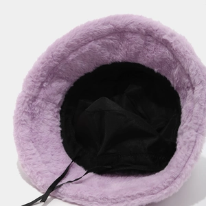 Inside view of a purple plush bucket hat with black lining and adjustable drawstring