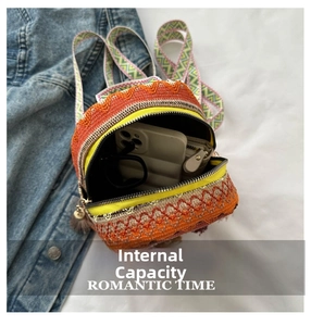 Internal capacity of ethnic woven mini backpack showing space for phone and essentials