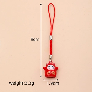 Detail of red Maneki-Neko bell pendant showing dimensions 9cm and weight 3.3g