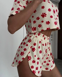 Detail view of cotton lounge set with side-slit shorts and red claw print pattern