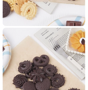 Close-up of realistic chocolate and butter cookie charms in various shapes on wood table