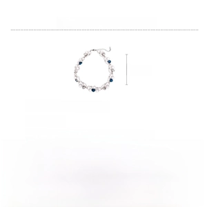 Detail view of crystal beaded necklace featuring blue heart pendant and pearl accents