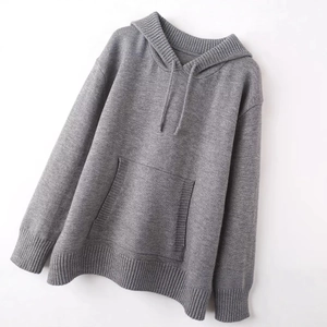 Women's casual oversized grey knit hoodie with long sleeves on a clean white background