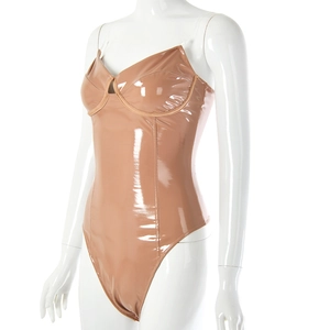 Detail of nude faux leather bodysuit featuring underwire cups and sleek glossy finish