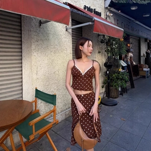 Vintage dark brown polka dot two-piece set with backless top and ruffled skirt