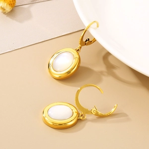French style gold titanium steel earrings with oval cat eye stone on ceramic plate
