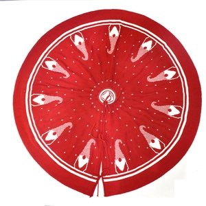Red knitted Christmas tree skirt featuring white gnome patterns and dual tie closures