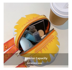 Detailed view of the yellow sunflower bag interior holding cosmetics and sunscreen