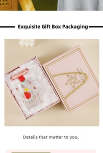 Close-up of strawberry glass cup set with lid in a premium gift box with silk lining