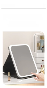 Detail of portable LED makeup mirror featuring three touch-sensitive light control buttons