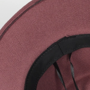 Detail view of burgundy wool felt hat showing precision stitching and adjustable sweatband