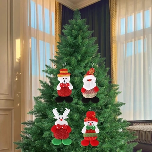 Detail of Santa, Bear, Reindeer and Snowman plush ornaments hanging on a Christmas tree