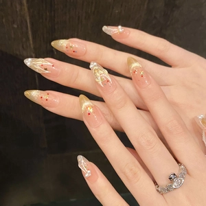 Handmade stiletto press-on nails with golden glitter gradient and white pearl accents