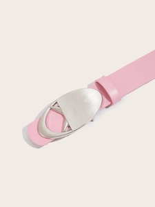 Close-up of pink faux leather belt featuring a silver geometric metal buckle design