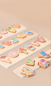 Detailed close-up of colorful wooden puzzles featuring fruits, dinosaurs, and vehicles